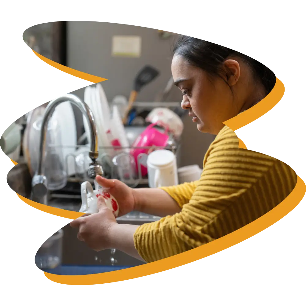 Disabled Indian woman doing dishes at home