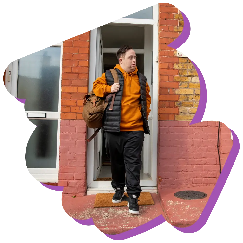 Disabled man with down syndrome walking out front door