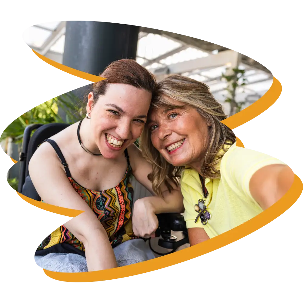 Happy disabled woman smiling with support worker